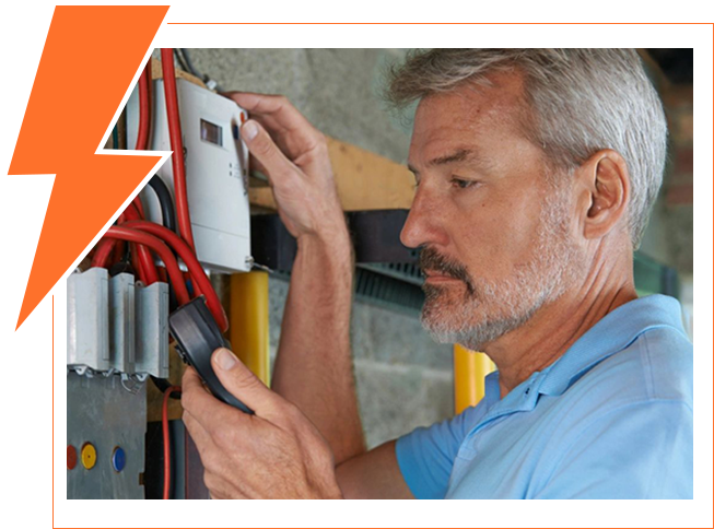 Electrician performing maintenance on an electrical panel.